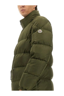Moncler men’s olive green quilted down jacket with high collar and logo patch on left sleeve in tuileries green