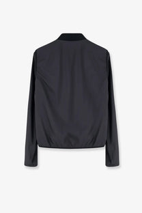 Moncler men’s Hemmoor black bomber jacket with sleek minimalist design and subtle sheen in lightweight nylon material