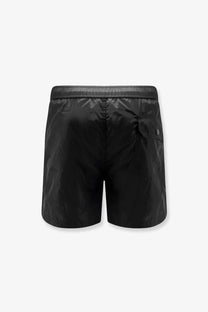 Moncler men’s black nylon swim trunks with a subtle sheen and a small logo on the side pocket
