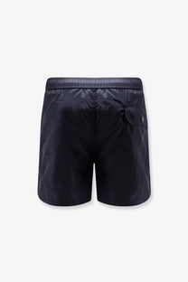Moncler men’s swim trunks in black nylon with sleek lightweight fabric and subtle reflective stitching