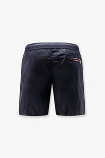 Moncler men’s nylon swim trunks in black with subtle red and white stripe detail on the side pocket