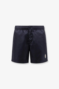 Moncler men’s dark navy nylon swim trunks with subtle logo on the lower right leg for swimming use