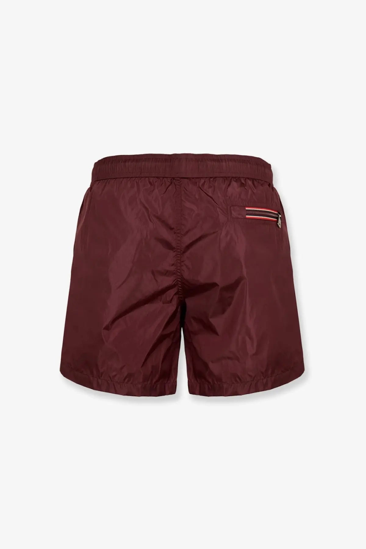 Moncler men’s brown nylon swim trunks with subtle sheen and side pocket with red white and black striped zipper trim