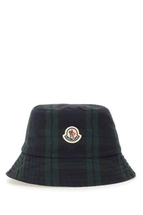 Moncler men’s reversible bucket hat in dark green and navy plaid with circular embroidered logo on front