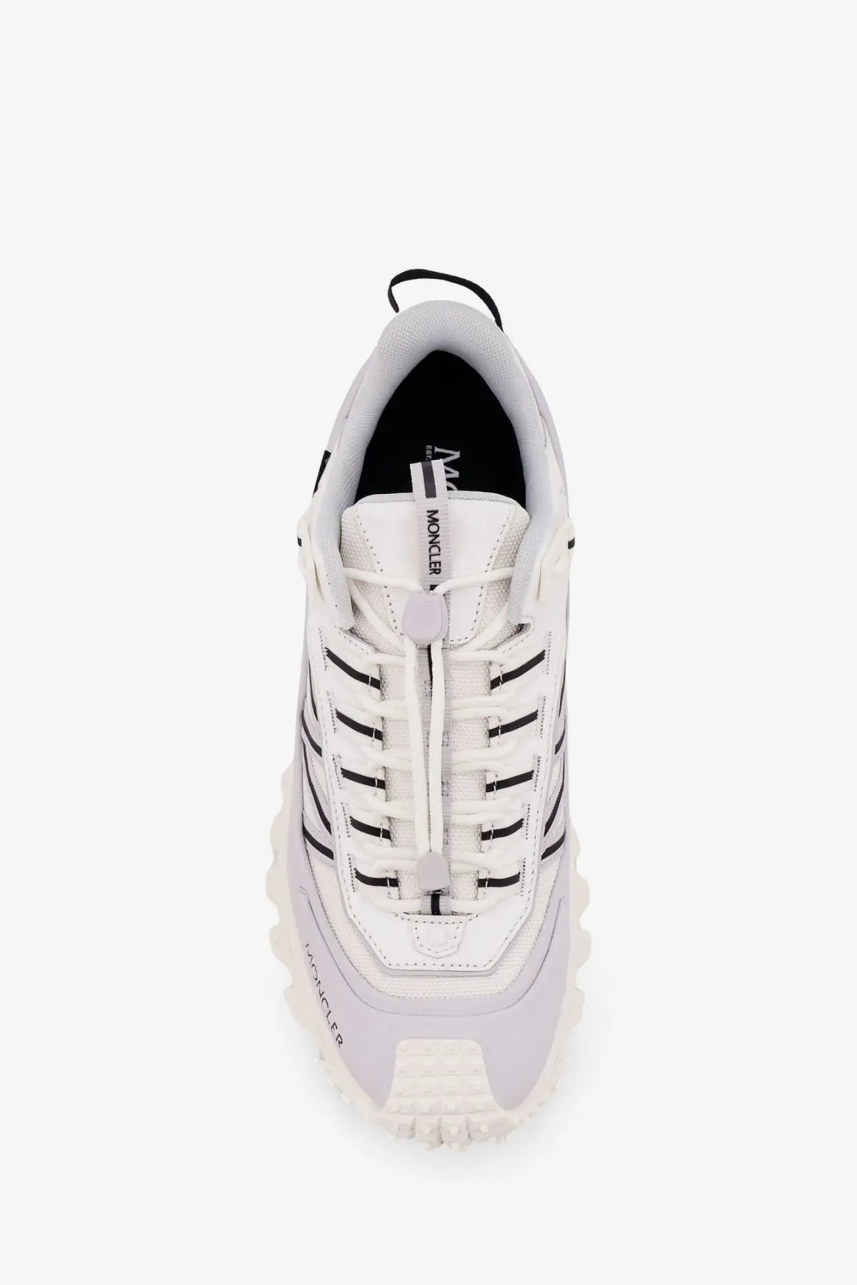 Moncler men’s trailgrip gtx leather and ripstop sneaker in white with black accents and a chunky textured sole