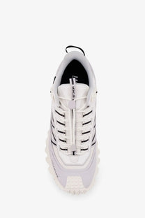 Moncler men’s trailgrip gtx leather and ripstop sneaker in white with black accents and a chunky textured sole