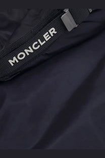 Black moncler strap with white lettering and metallic buckle on moncler men’s trestraou down jacket blue