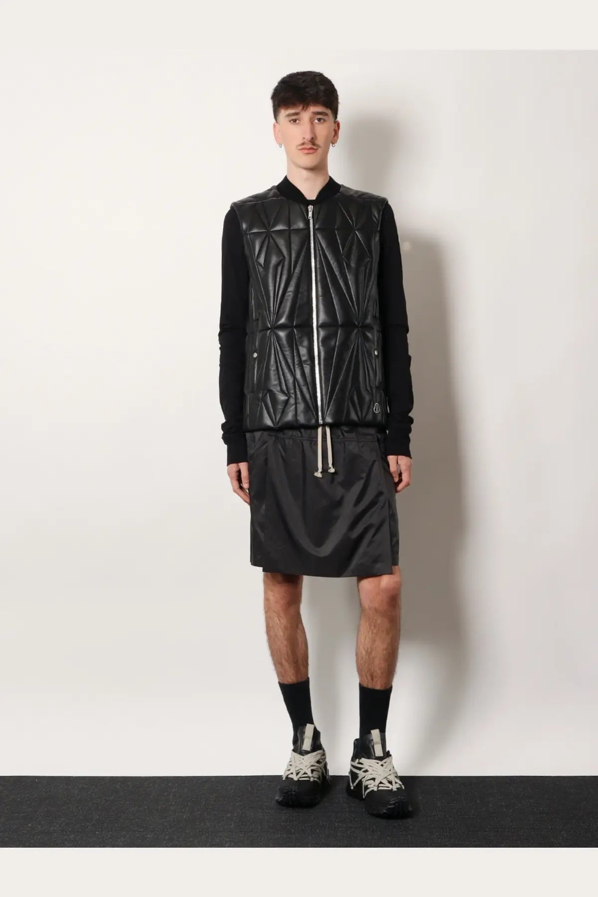 Black quilted leather vest with geometric stitching and central zipper from Moncler + Rick Owens Geocamo Flight collection