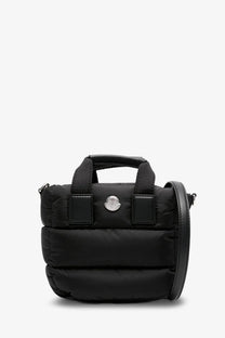 Moncler women’s caradoc micro nylon shoulder bag black quilted puffer style with silver logo plaque and leather strap