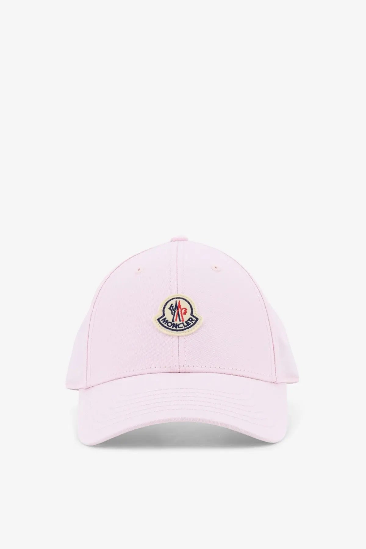 Moncler women’s soft pink cotton baseball hat with circular embroidered logo in red, blue, and black on front