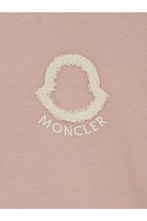 Moncler women’s soft pink cotton t-shirt with textured off-white embroidered logo and arched brand name below