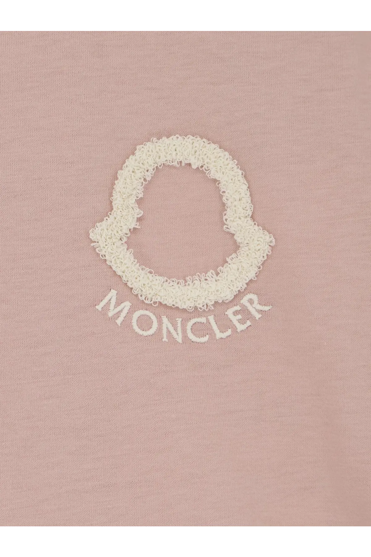 A soft pink moncler women’s cotton t-shirt featuring an off-white textured embroidered logo and brand name