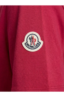 Red moncler logo patch on textured knit fabric of moncler women’s red cotton shirt