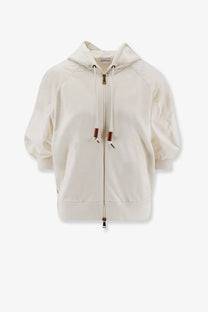 Moncler women’s white cotton sweatshirt with cream-colored hooded zip-up jacket featuring ribbed cuffs and leather pull pockets