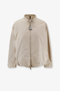 Beige Moncler women’s Gruissan bomber jacket with stand-up collar and front zipper closure with triangular metal pull tab