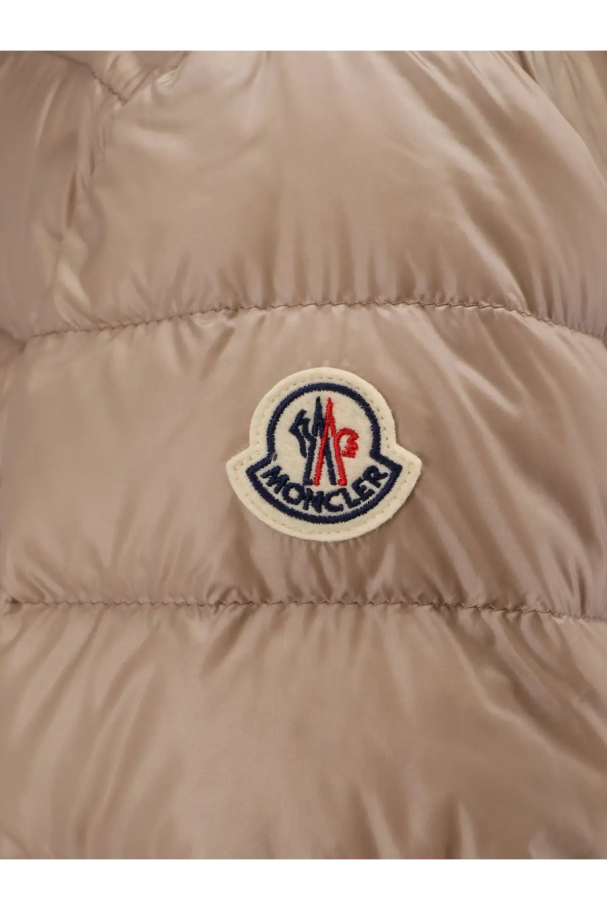 Beige Moncler women’s Jasmin hooded down jacket with circular embroidered logo patch on the chest