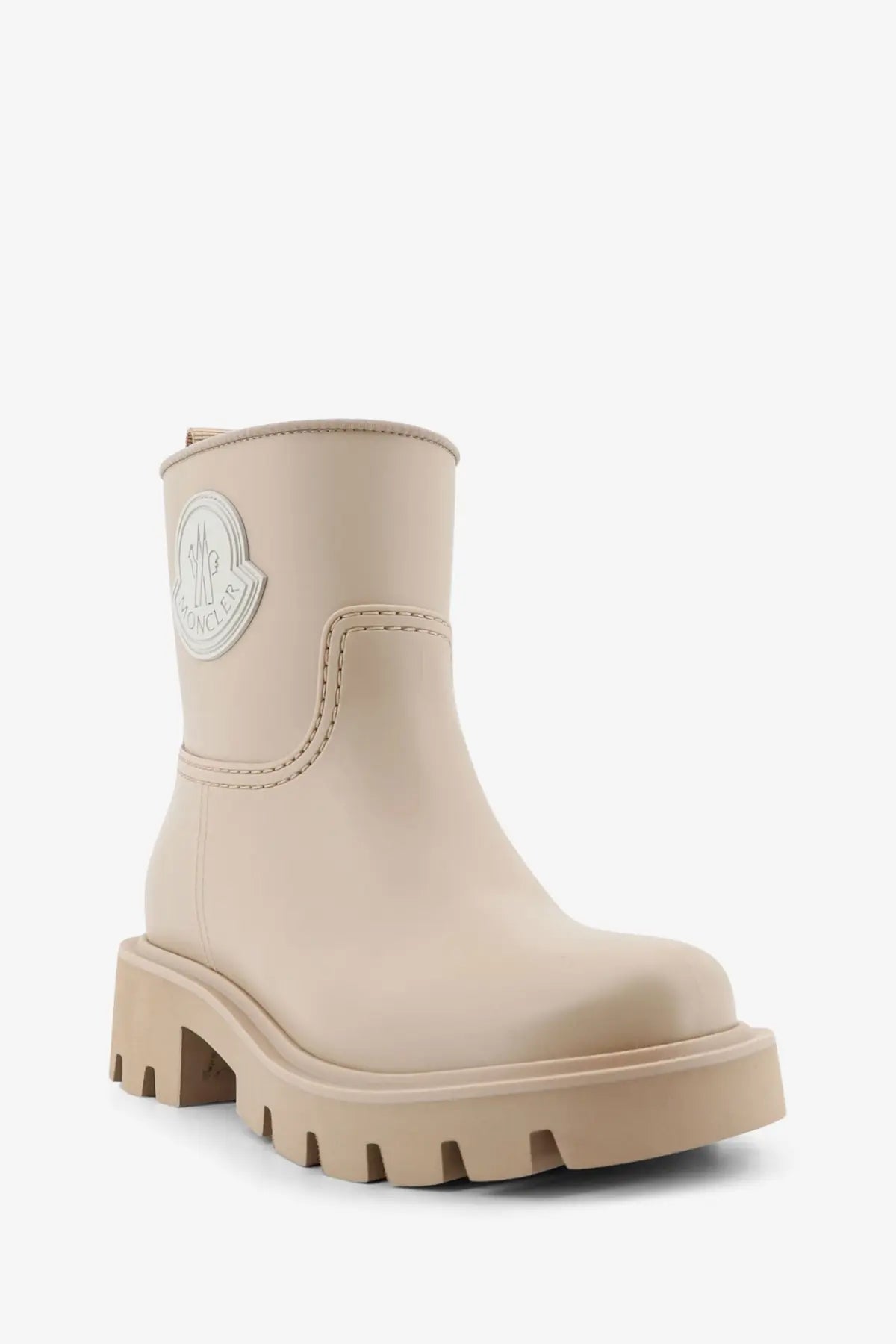 Beige moncler women’s kickstream ankle boot with glossy finish and chunky textured rubber sole for rainwear
