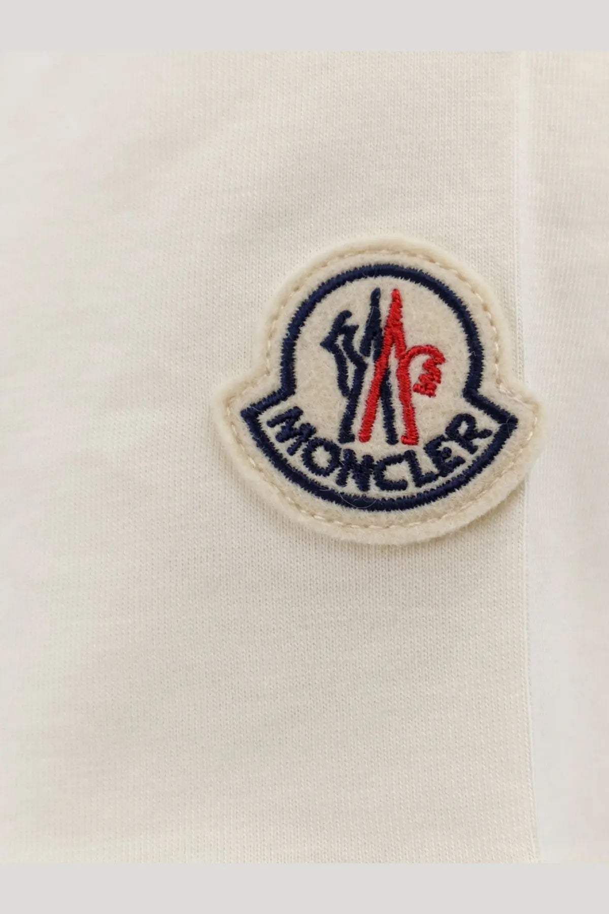 Moncler women’s organic cotton shirt white featuring white logo patch with embroidered red and navy blue insignia