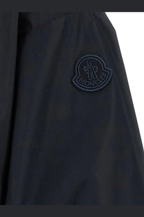 Dark navy moncler logo patch on the sleeve of a sleek blue water-resistant nylon women’s pecher jacket