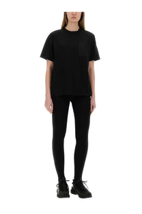 Moncler women’s oversized black short-sleeved shirt with a subtle chest pocket in soft cotton material