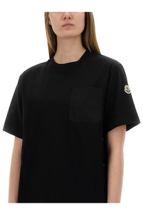 Moncler women’s black short-sleeved t-shirt with chest pocket and logo patch on the sleeve in cotton material
