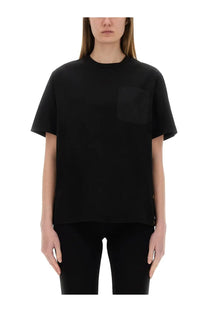 Moncler women’s black short-sleeved cotton t-shirt with a single chest pocket for casual wear