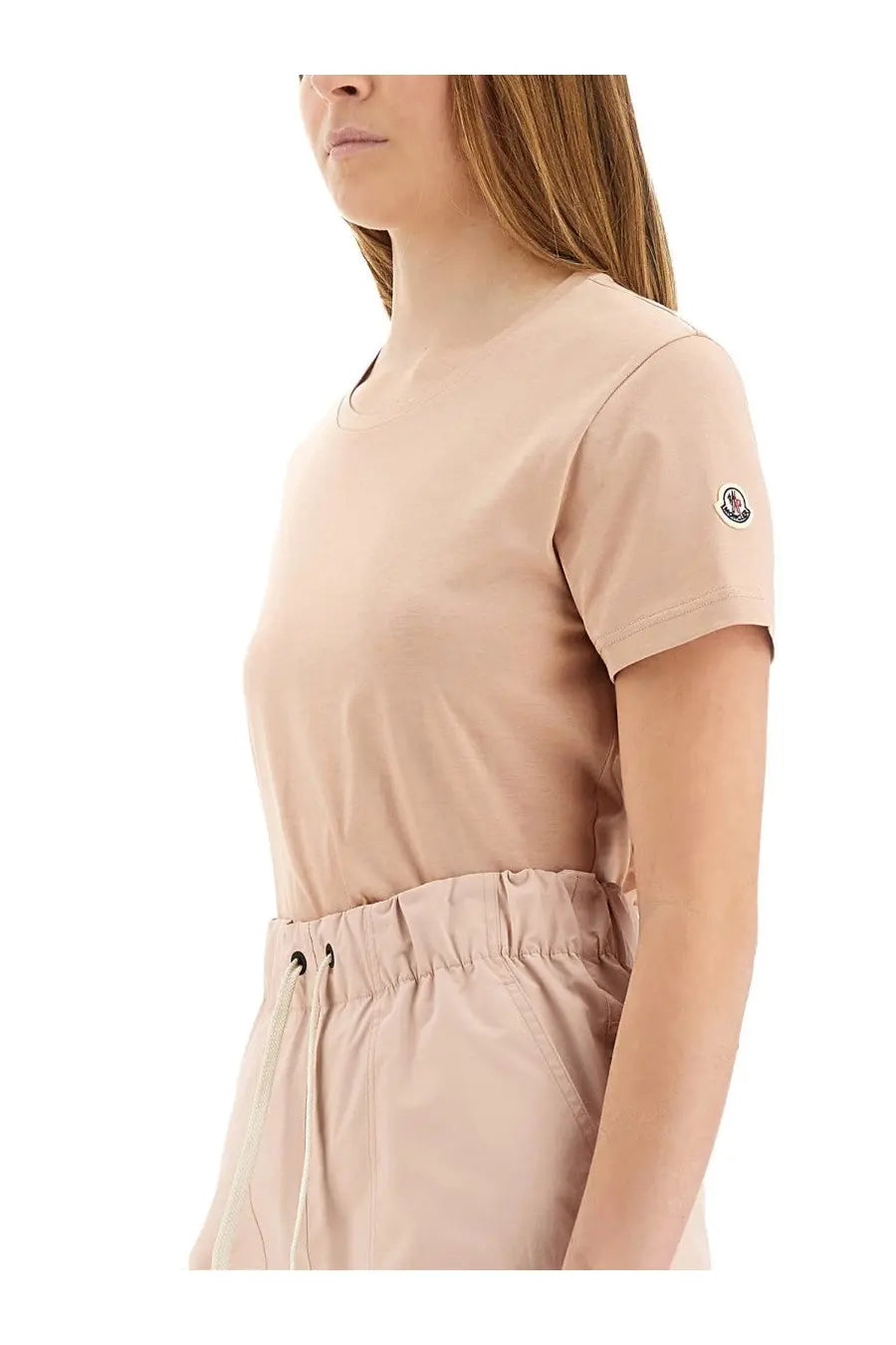 Beige Moncler women’s short-sleeved t-shirt with round neckline and subtle logo patch on the sleeve