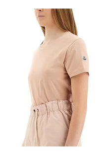 Beige Moncler women’s short-sleeved t-shirt with round neckline and subtle logo patch on the sleeve