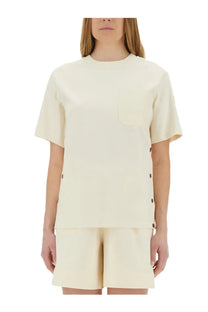 Moncler women’s cream short-sleeved shirt with chest pocket and side seam button details in white cotton blend
