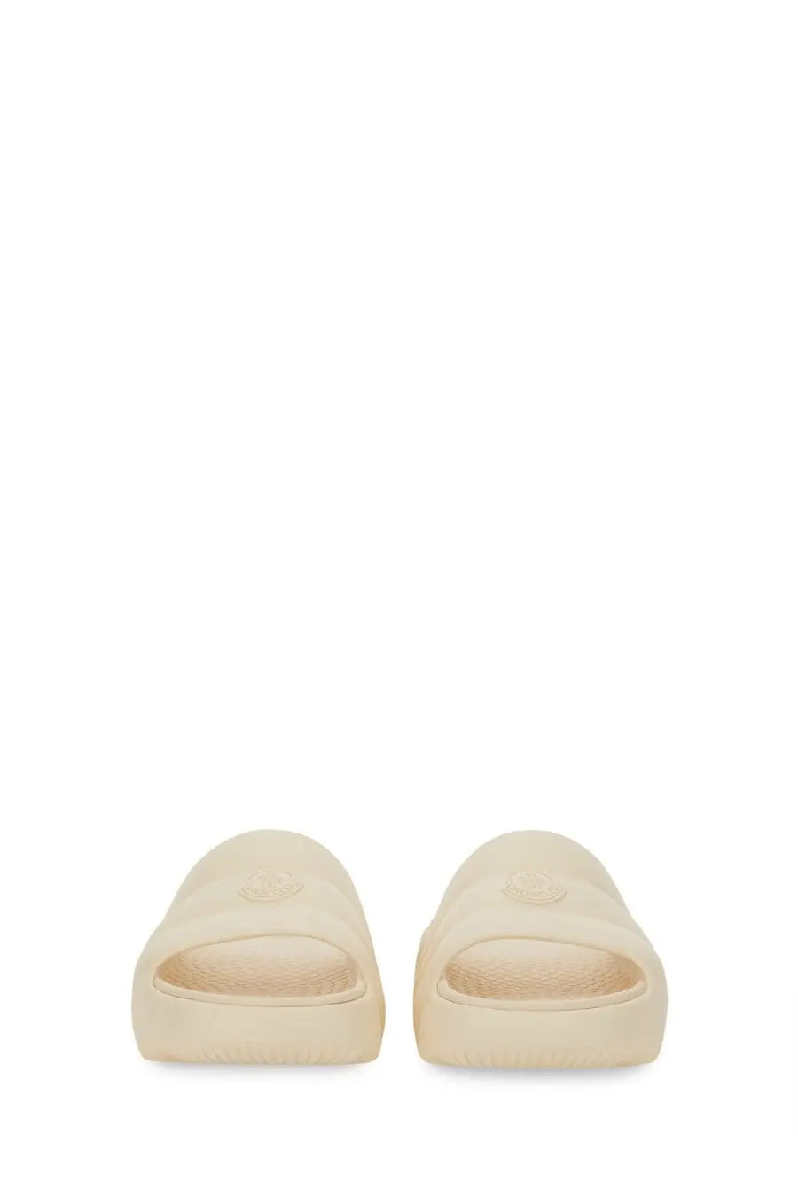 Moncler women’s cream-colored slide sandal with minimalist design and embossed Fendi logo on the footbed