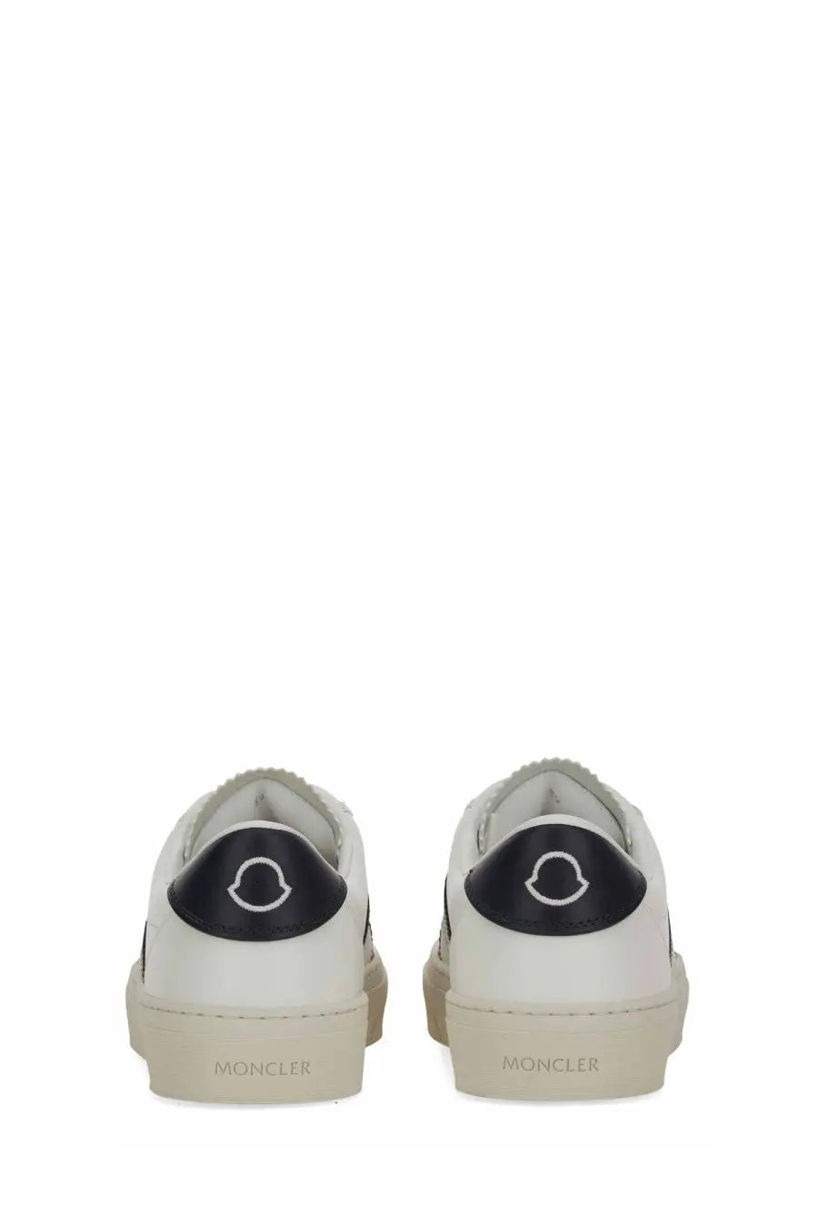 Moncler women’s sneaker white in white leather with black rubber heel tabs featuring the brand logo back view