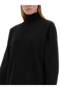 Moncler women’s black high-neck sweatshirt with subtle embroidered logo on the chest made from soft fabric