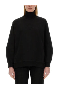 Moncler women’s black high-neck sweatshirt with subtle embroidered logo on chest in soft fabric