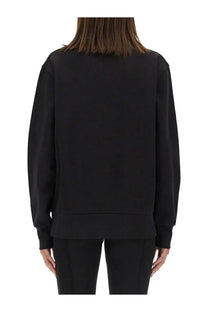 Moncler women’s black oversized crewneck sweatshirt with relaxed fit and ribbed cuffs made from soft material