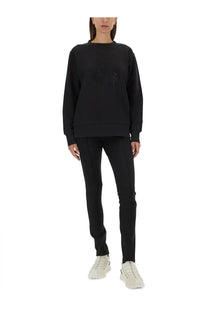 Moncler women’s black oversized sweatshirt with subtle embroidered logo on chest, perfect for casual wear