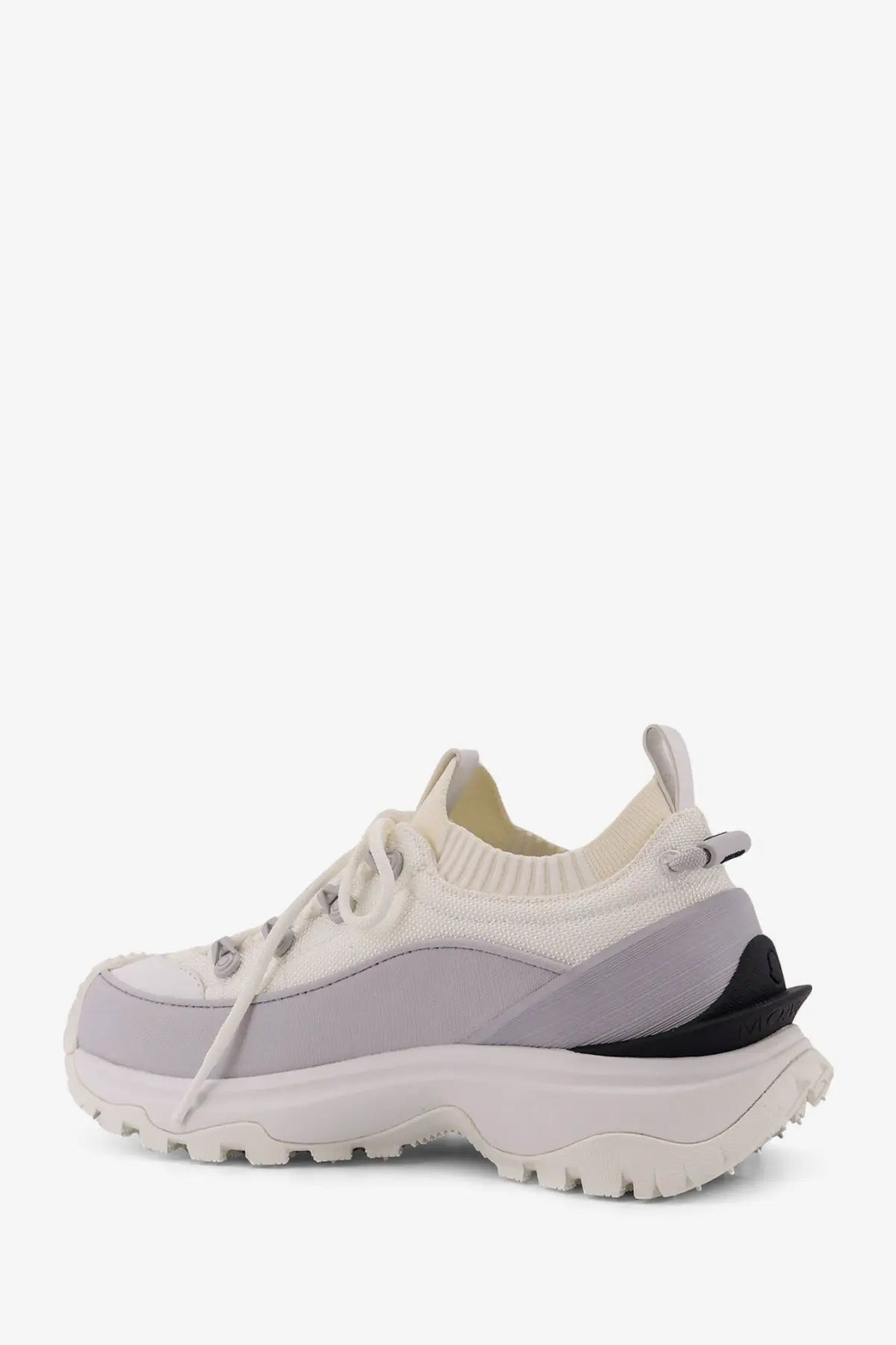 Moncler women’s trailgrip Lite3 knit sneaker in cream and light gray with chunky white sole and black rubber heel detailing