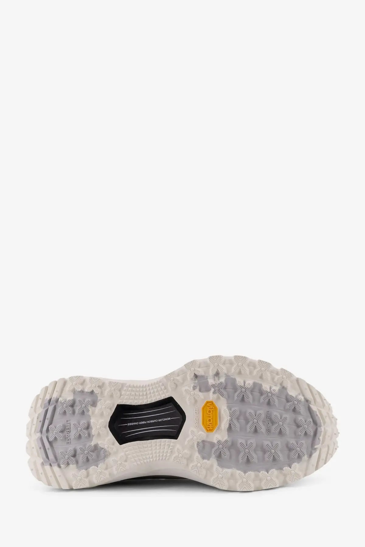 The shoe sole of moncler women’s trailgrip lite3 white sneakers features rugged off-white rubber tread with orange vibram logo