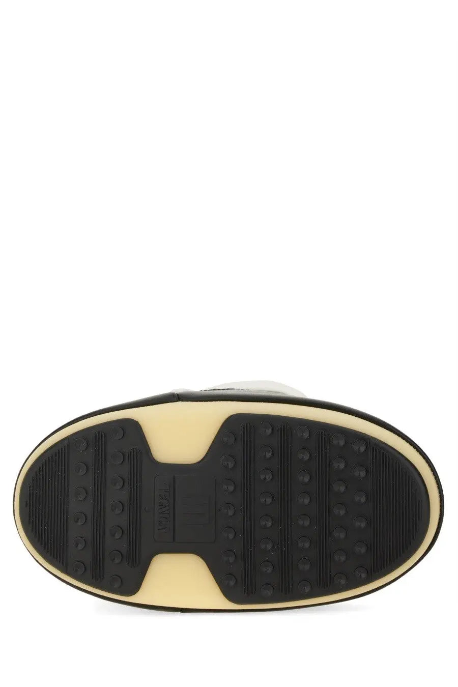 Black and cream rubber sole with textured tread and moonsoles branding on moon boot unisex icon boot multicolor