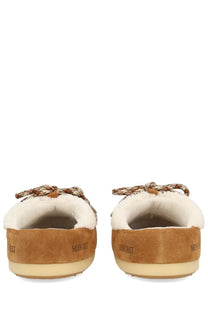 Tan suede moon boot unisex shearling evx mules with white shearling lining and patterned braided tie