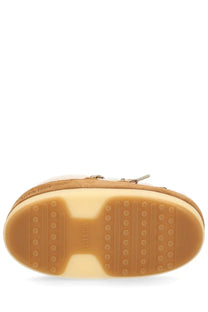 Tan suede moon boot unisex shearling evx mules with soft plush interior and rubber sole with circular tread patterns