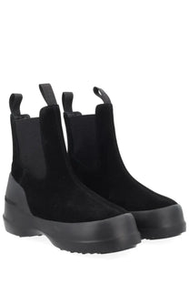 Black suede Moon Boot women’s Chelsea boot with chunky rubber sole and pull tabs in moon black color