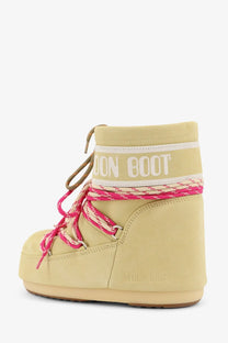 Moon Boot women’s icon low suede boots in pale yellow with vibrant pink and white laces and a bold logo band around the ankle