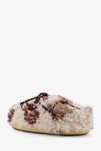 Cream and brown curly wool slip-on mule shoe with braided laces from moon boot womens low faux fur sandals pattern