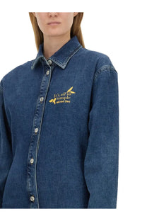 Blue denim button-up shirt dress with gold embroidery reading its all so simple by Moschino Jeans