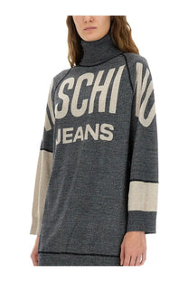 Moschino Jeans women’s grey inlaid dress featuring a dark gray knit turtleneck with beige sleeve panels and bold white lettering