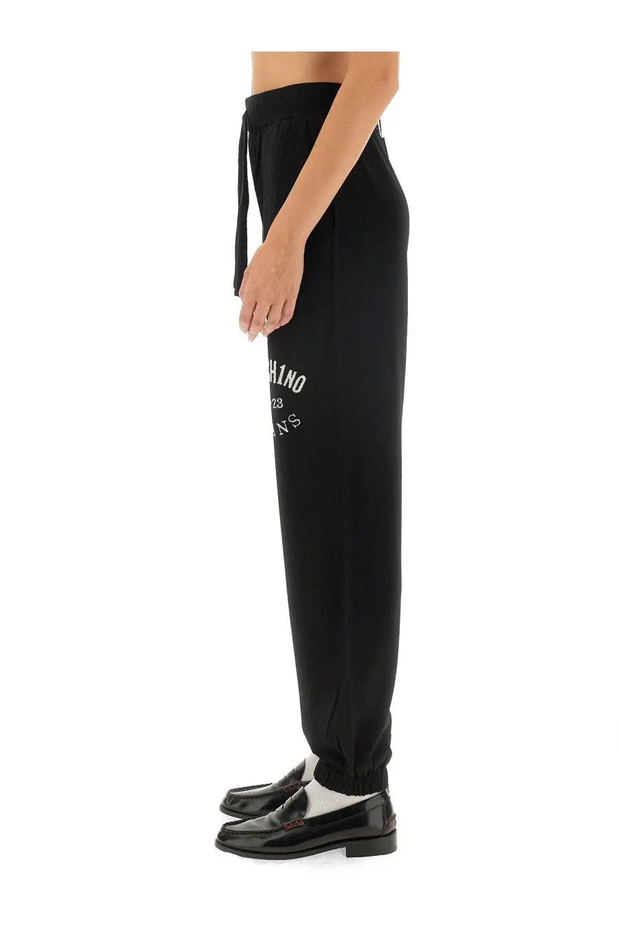 Moschino Jeans women’s black jogger pants with drawstring waistband and white embroidered text on left thigh