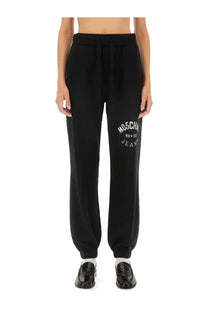 Black moschino jeans women’s jogging pants featuring white embroidered logo on the left thigh in soft fabric