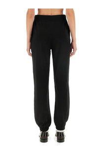 Black Moschino Jeans women’s jogger pants with high-waisted elastic waistband and ribbed cuffs tapered fit