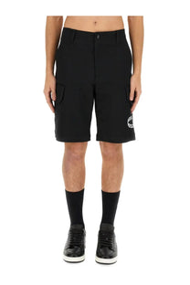 Moschino men’s bermuda black cargo shorts with a subtle white logo on the lower leg for casual wear
