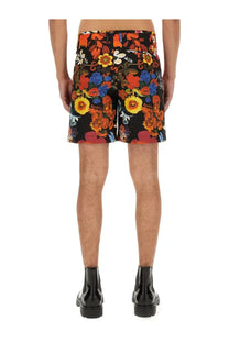 Moschino men’s bermuda black shorts with vibrant orange yellow blue and red floral pattern for casual wear